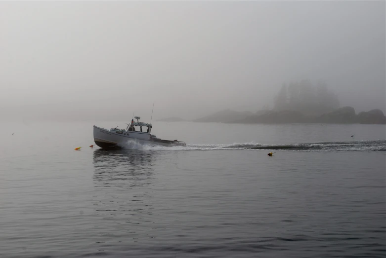 a boat in the water on a foggy day, light grey mist, sea queen, 2022 photograph, jonathan dufresne