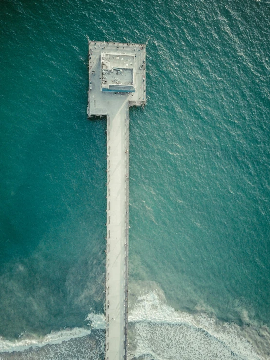 an aerial view of a pier in the ocean, pexels contest winner, renaissance, centered in portrait, helipad, profile pic, wall of water either side