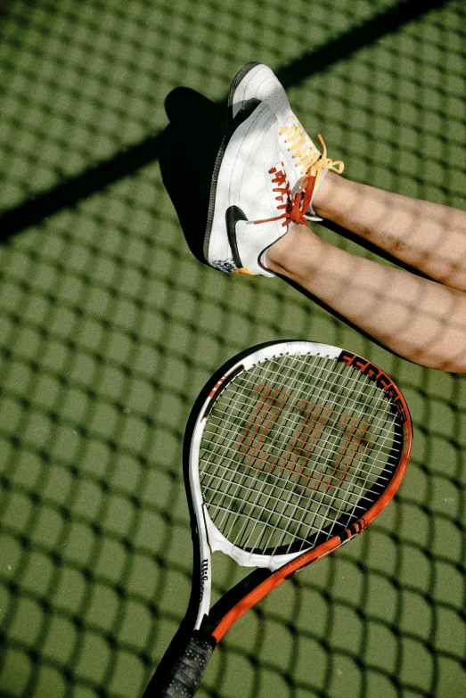 a woman standing on top of a tennis court holding a racquet, by Robert Medley, unsplash, photorealism, running shoes, white and orange, mid air shot, taken in the late 2000s