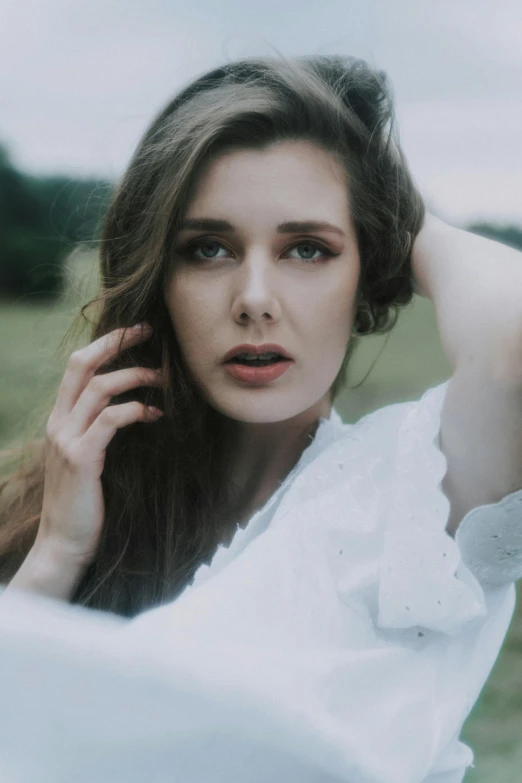 a beautiful young woman sitting on top of a lush green field, inspired by Elsa Bleda, pexels contest winner, renaissance, pale white face, close-up portrait film still, ((portrait)), color photograph portrait 4k