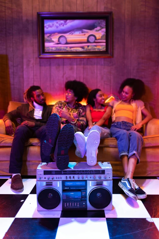 a group of people sitting on top of a couch, an album cover, trending on pexels, funk art, movie still, profile image, indoor scene, ( ( theatrical ) )