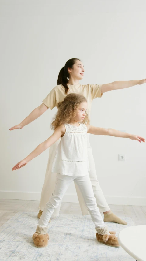 a woman standing next to a little girl on top of a rug, arabesque, stands in center with open arms, 15081959 21121991 01012000 4k, white-space-surrounding, full body 8k