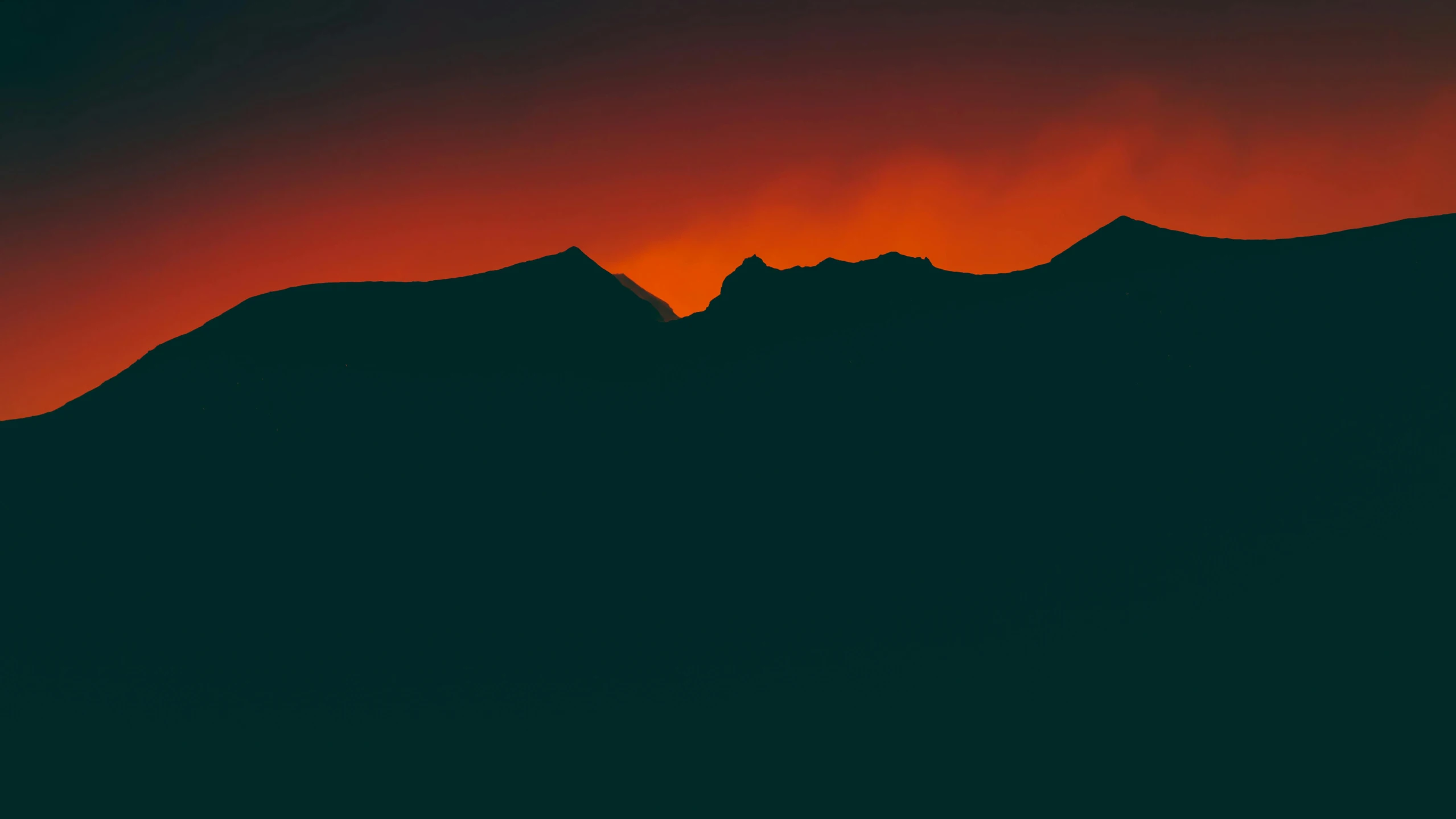 the sun is setting behind the mountains, by Attila Meszlenyi, minimalism, vibrant red 8k, fires, dark photo, orange and teal color