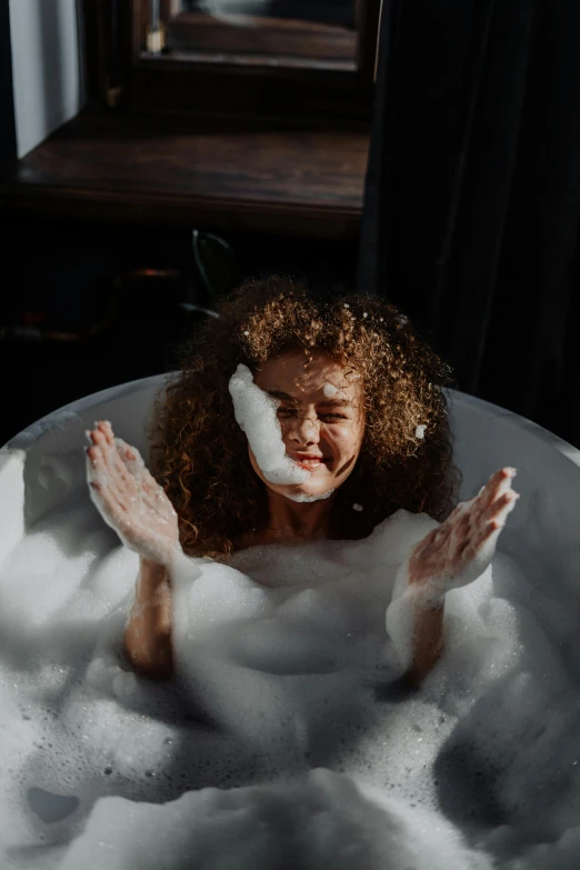 a woman in a bathtub with foam on her face, trending on pexels, renaissance, bubbling cauldron, curly haired, huge bubbles, playful smirk