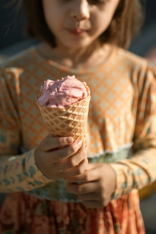 a little girl holding an ice cream cone, unsplash contest winner, renaissance, light pink, red velvet, medium close up, edible