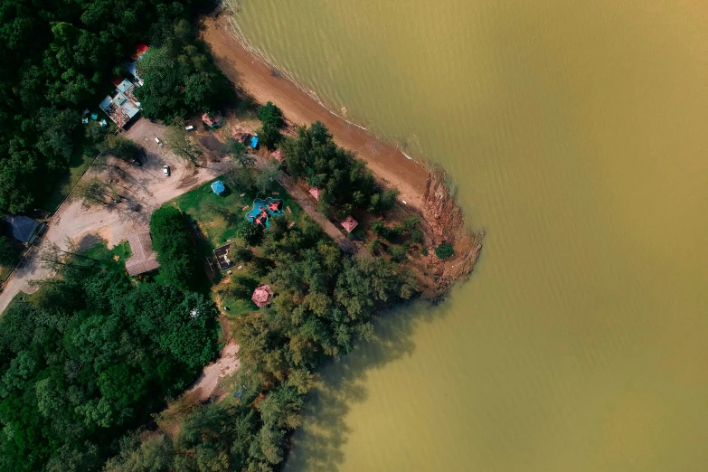 a large body of water next to a forest, an album cover, by Attila Meszlenyi, trending on unsplash, land art, cambodia, flooded fishing village, photogrammetry, 15081959 21121991 01012000 4k