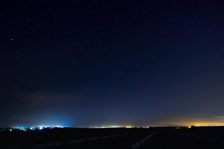 a night sky filled with lots of stars, pexels contest winner, distant town lights, wide horizon, blue and clear sky, iso 1 0 0 wide view