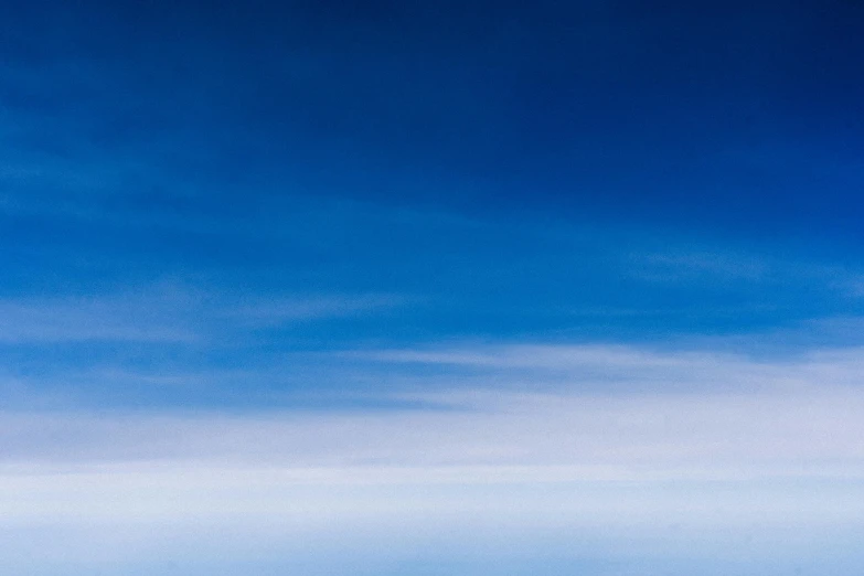 a group of people riding skis on top of a snow covered slope, an album cover, inspired by Jan Rustem, unsplash, minimalism, panorama view of the sky, blue: 0.5, stratosphere, minimalist wallpaper