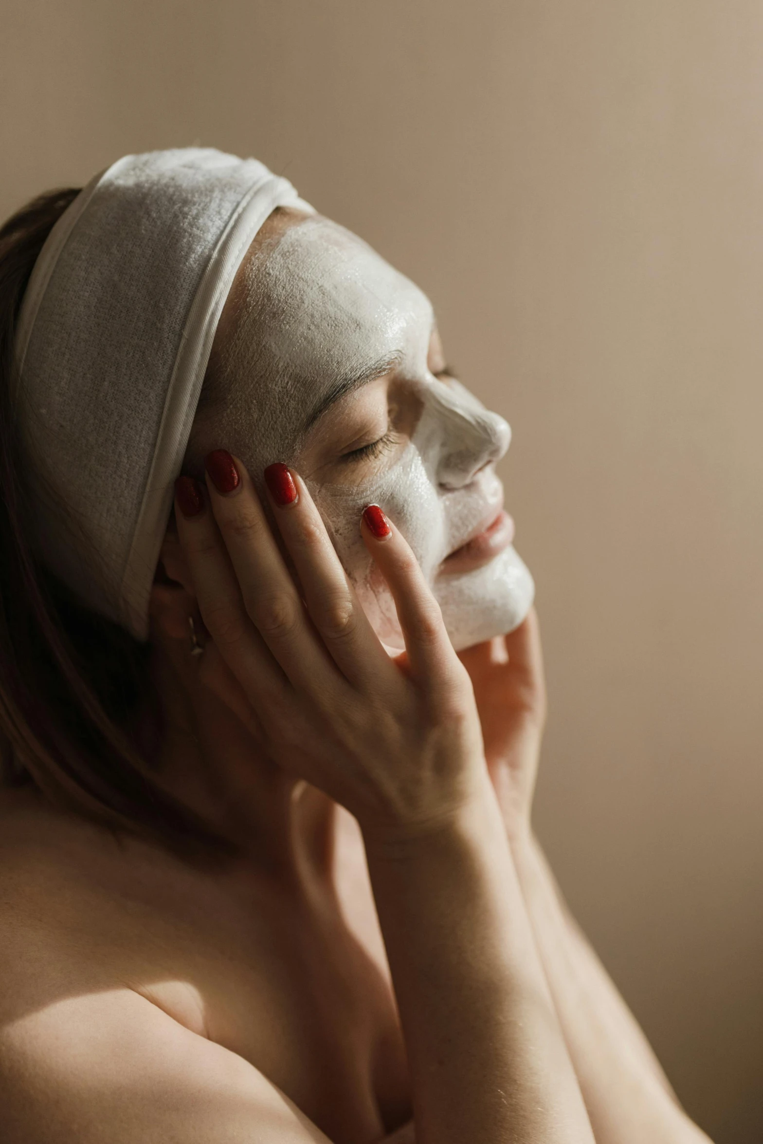 a woman with a sheet mask on her face, trending on pexels, renaissance, soft light from the side, spa, delightful, sculpted