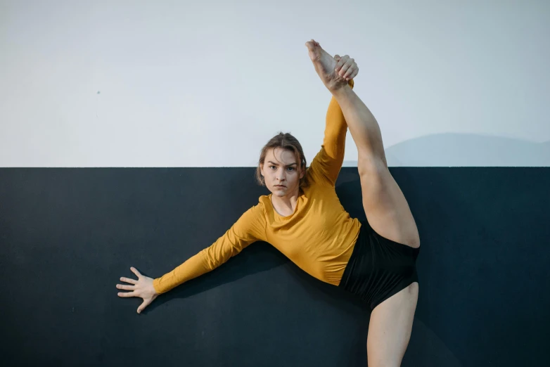 a woman in a leo leo leo leo leo leo leo leo leo leo leo leo leo leo, inspired by Elizabeth Polunin, unsplash, with yellow cloths, sydney hanson, stretching to walls, portrait sophie mudd