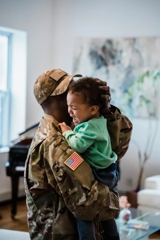 a soldier holding a child in a living room, pexels contest winner, renaissance, tears, african american, square, in military uniform