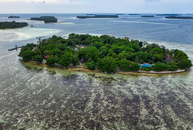 a small island in the middle of the ocean, by Peter Churcher, pexels contest winner, hurufiyya, malaysia jungle, totalitarian prison island, panoramic view, slide show