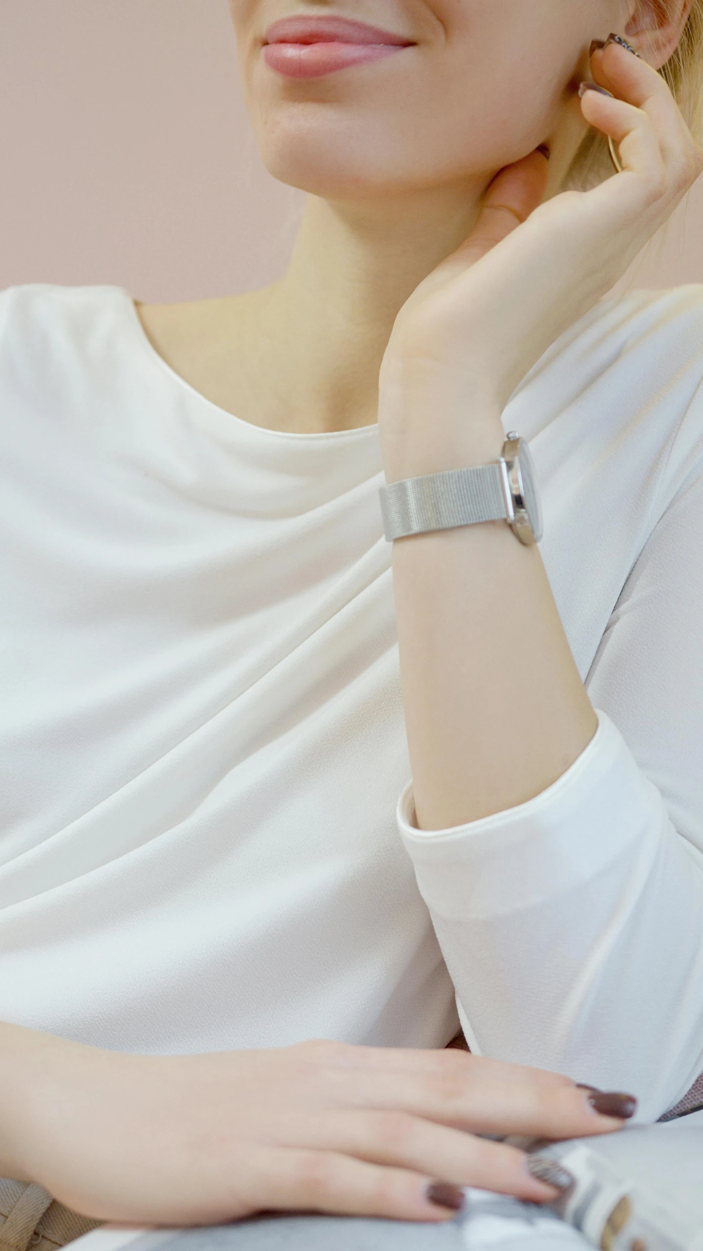 a woman sitting in front of a laptop computer, inspired by Cheng Jiasui, pinterest, minimalism, silver sports watch, gray shirt, profile shot, square