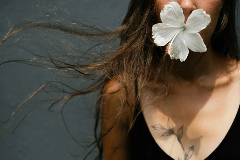 a woman with a flower in her mouth, a tattoo, trending on pexels, minimalism, big leaf bra, the wind moves her shirt, mother of pearl jewelry, flowers growing out of his body