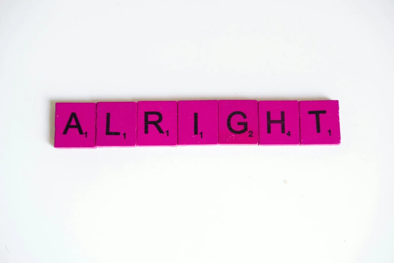 a pink scrabble with the word alright on it, an album cover, by Maginel Wright Enright Barney, trending on unsplash, feminist art, with a white background, bright volumetric sunlight, karl pilkington, enlightenment