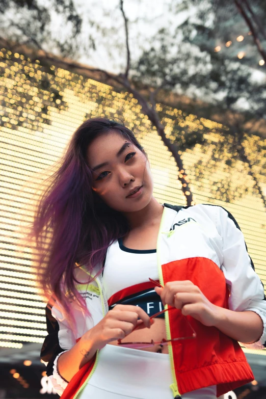 a woman with purple hair standing in front of a building, inspired by Feng Zhu, unsplash, wearing a track suit, set on singaporean aesthetic, gaming, profile image