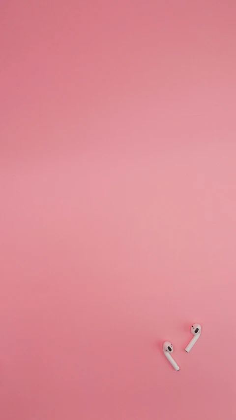 a couple of toothbrushes sitting on top of a pink surface, a minimalist painting, inspired by Scarlett Hooft Graafland, ffffound, hiroshi sugimoto, cotton fabric, seamless
