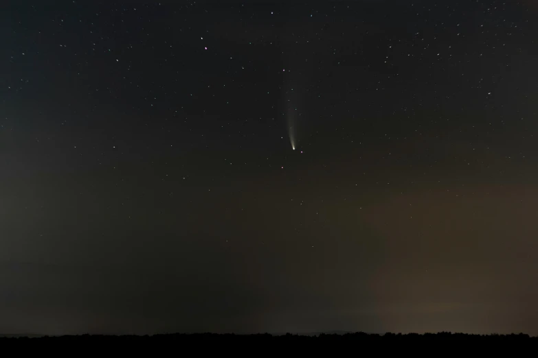 a comet is seen in the night sky, by Dan Frazier, pexels, observed from afar in the fog, from wheaton illinois, kek, break of dawn on neptun