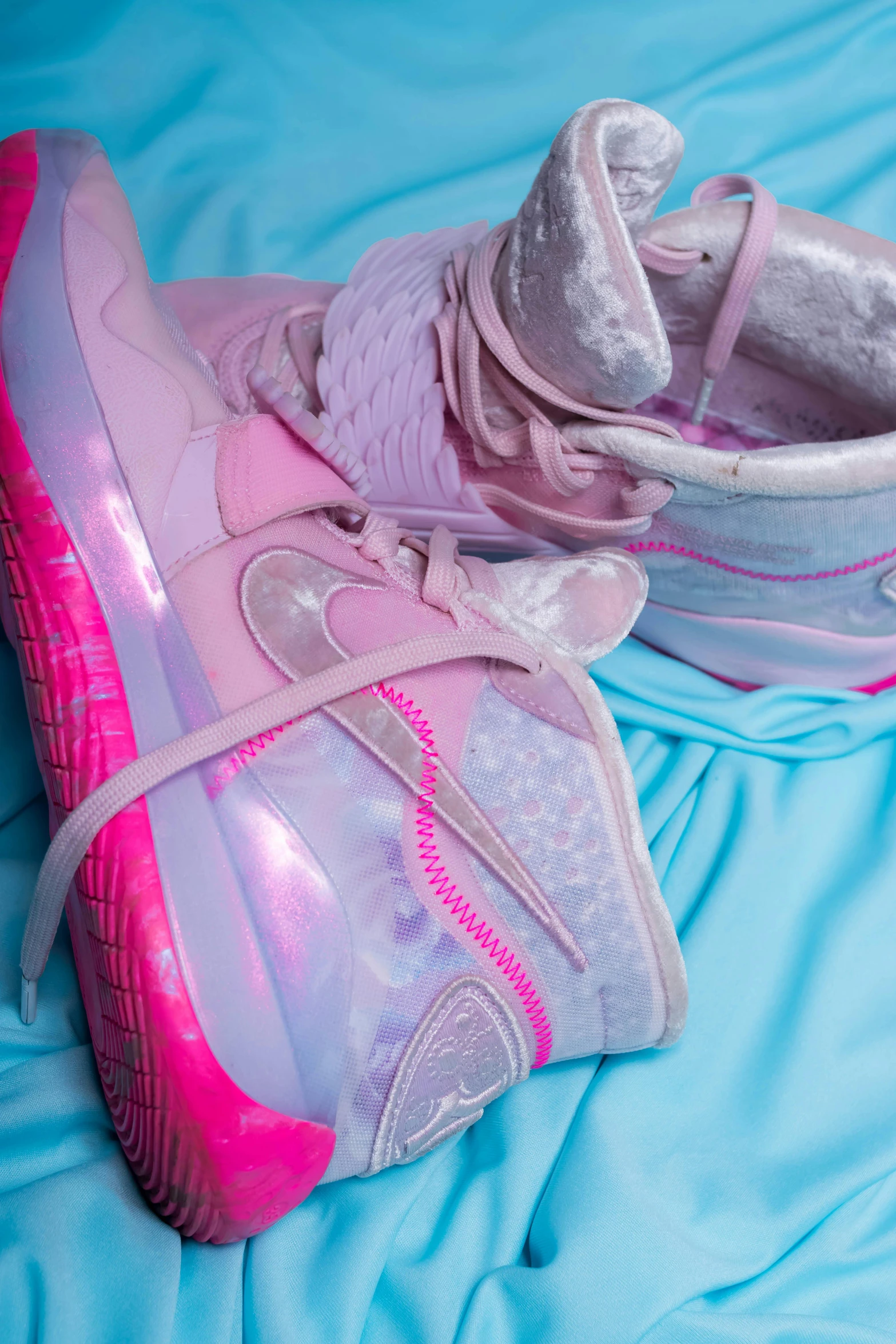 a pair of pink shoes sitting on top of a bed, a digital rendering, inspired by Pearl Frush, trending on pexels, renaissance, holographic neon highlights, air force, nicki minaj, high détails