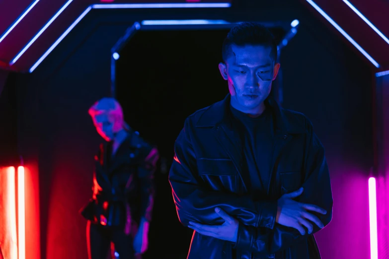 a man standing in a dark room with neon lights, cyberpunk art, inspired by Wang Duo, very aesthetic leather jacket, medium shot of two characters, in style of kar wai wong, promotional image