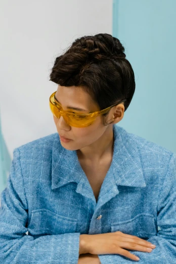 a woman sitting at a table with a plate of food in front of her, by Natasha Tan, altermodern, yellow carrera glasses, worksafe. cinematic, kiko mizuhara, wearing human air force jumpsuit
