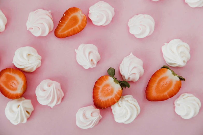 a pink plate topped with strawberries and whipped cream, a black and white photo, by Olivia Peguero, trending on pexels, candy treatments, background image, minimalist background, thumbnail