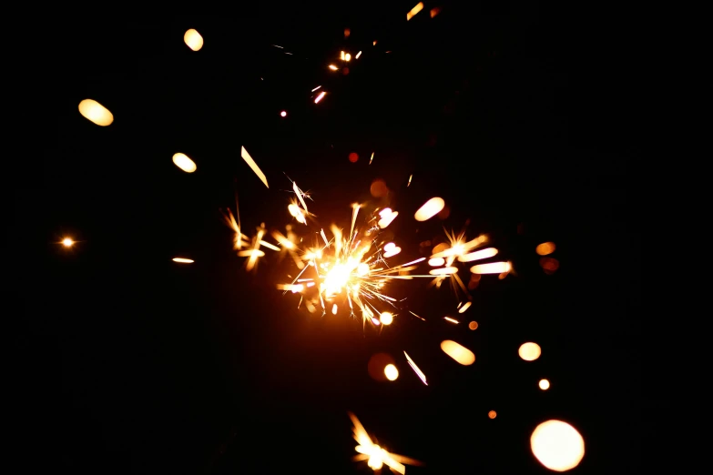 a close up of a sparkler in the dark, pexels, light and space, taken on iphone 14 pro, volumetric lightening, metalwork, aaaaaaaaaaaaaaaaaaaaaa