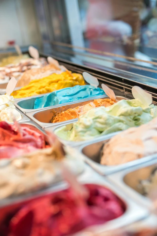 a display case filled with lots of different types of ice cream, pexels, process art, award winning color photo, blue, thumbnail, 1 2 9 7