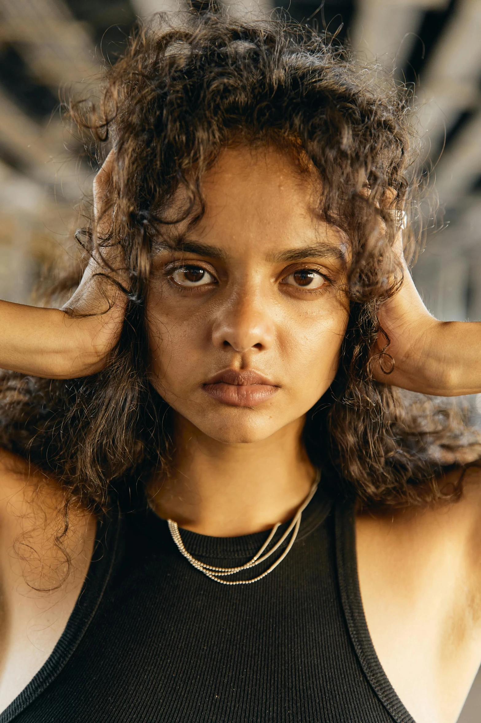 a woman holding her hair in front of her face, trending on pexels, renaissance, tessa thompson inspired, young middle eastern woman, sweaty face, serious focussed look