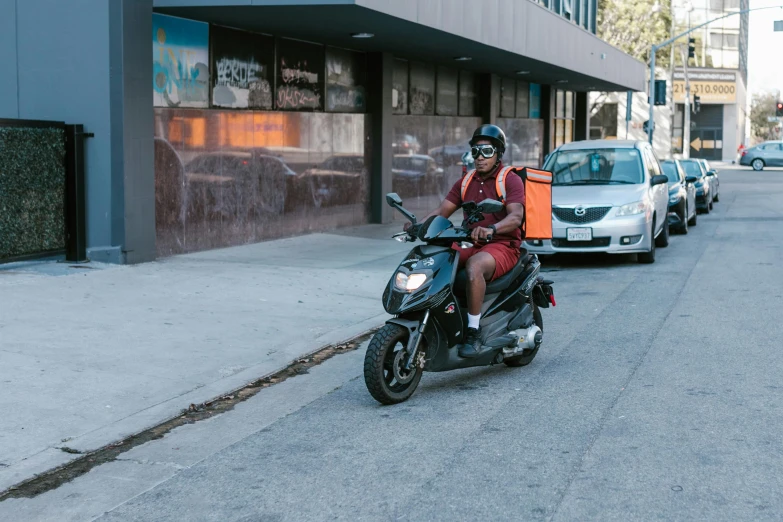 a man riding on the back of a motorcycle down a street, ready to eat, square, maroon, thumbnail