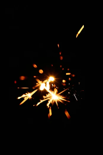 a close up of a sparkler in the dark, pexels, light and space, 15081959 21121991 01012000 4k, confetti, ilustration, welding torches for arms