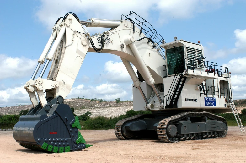 a large excavator sitting on top of a dirt field, mech shaped like a manatee, white, kawasaki, ultra - quality