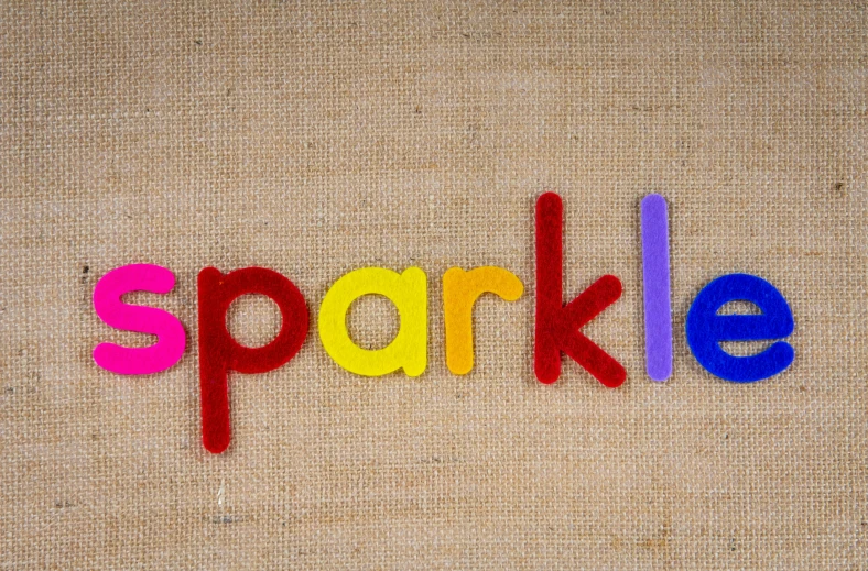 the word sparkle spelled in colorful plastic letters, a stipple, by Arabella Rankin, pexels, burlap, cutie mark, eric carle, sparky