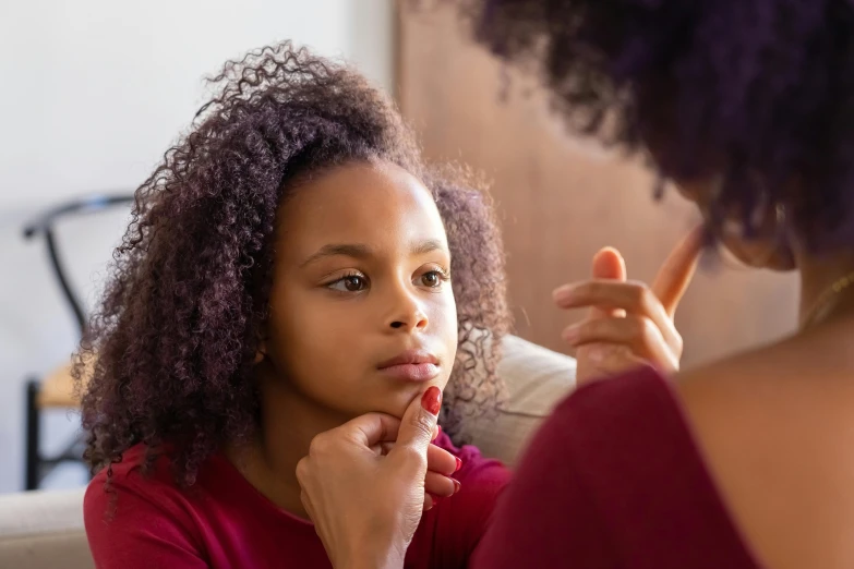 a young girl looks at her reflection in a mirror, trending on pexels, hurufiyya, cleft chin, unclipped fingernails, african american young woman, children playing with pogs