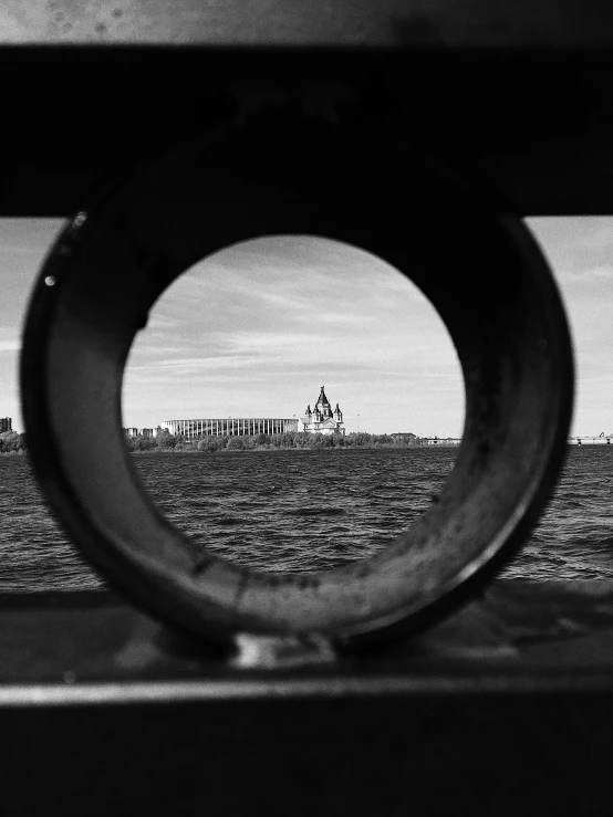 a black and white photo of a body of water, a black and white photo, by Mathias Kollros, optical illusion, metal eye piece, chateau frontenac, view from inside, naval landscape