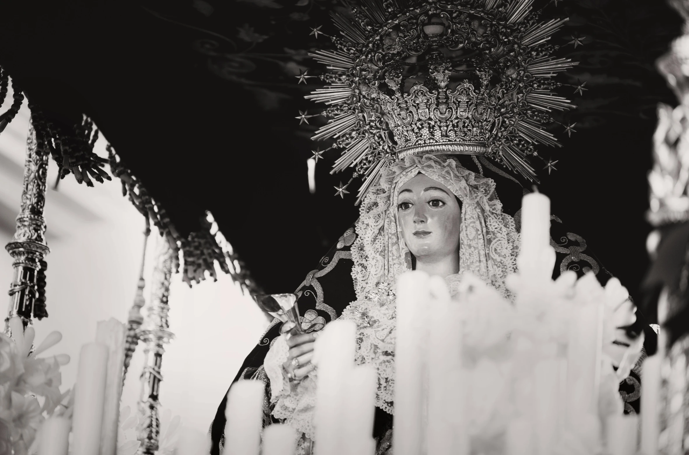 a black and white photo of a woman with a crown on her head, a black and white photo, pexels, baroque, virgin mary, in spain, hight decorated, gif