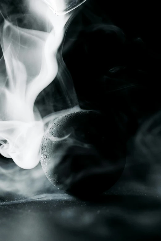 a black and white photo of smoke coming out of a cup, inspired by Carrie Mae Weems, pexels contest winner, ghost sphere, mint, a close up shot, smoking a magical bong