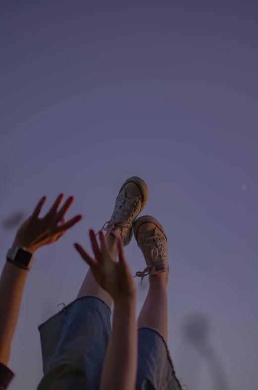 a group of people standing on top of a grass covered field, a picture, trending on pexels, aestheticism, happy toes, under the moon, sneaker photo, hands reaching for her