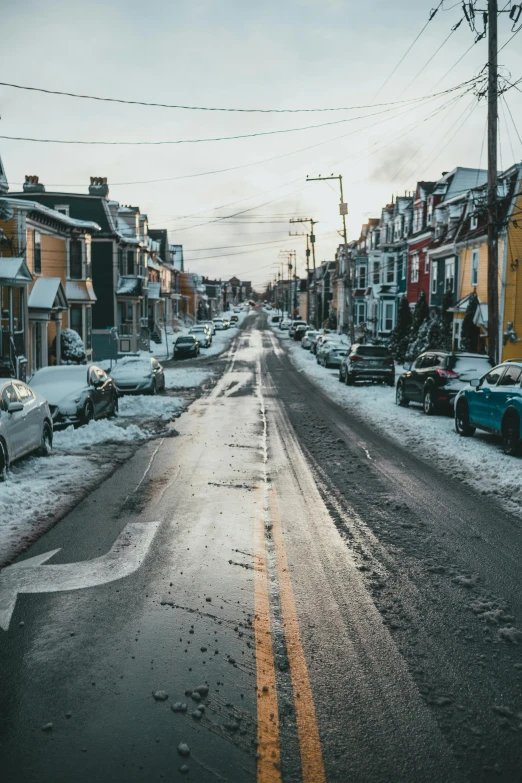 a street lined with parked cars covered in snow, pexels contest winner, renaissance, neighborhood themed, wet pavement, quebec, pittsburgh