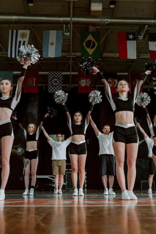 a group of young women standing on top of a basketball court, trending on unsplash, antipodeans, a teenage girl cheerleader, performing on stage, still from a movie, 15081959 21121991 01012000 4k