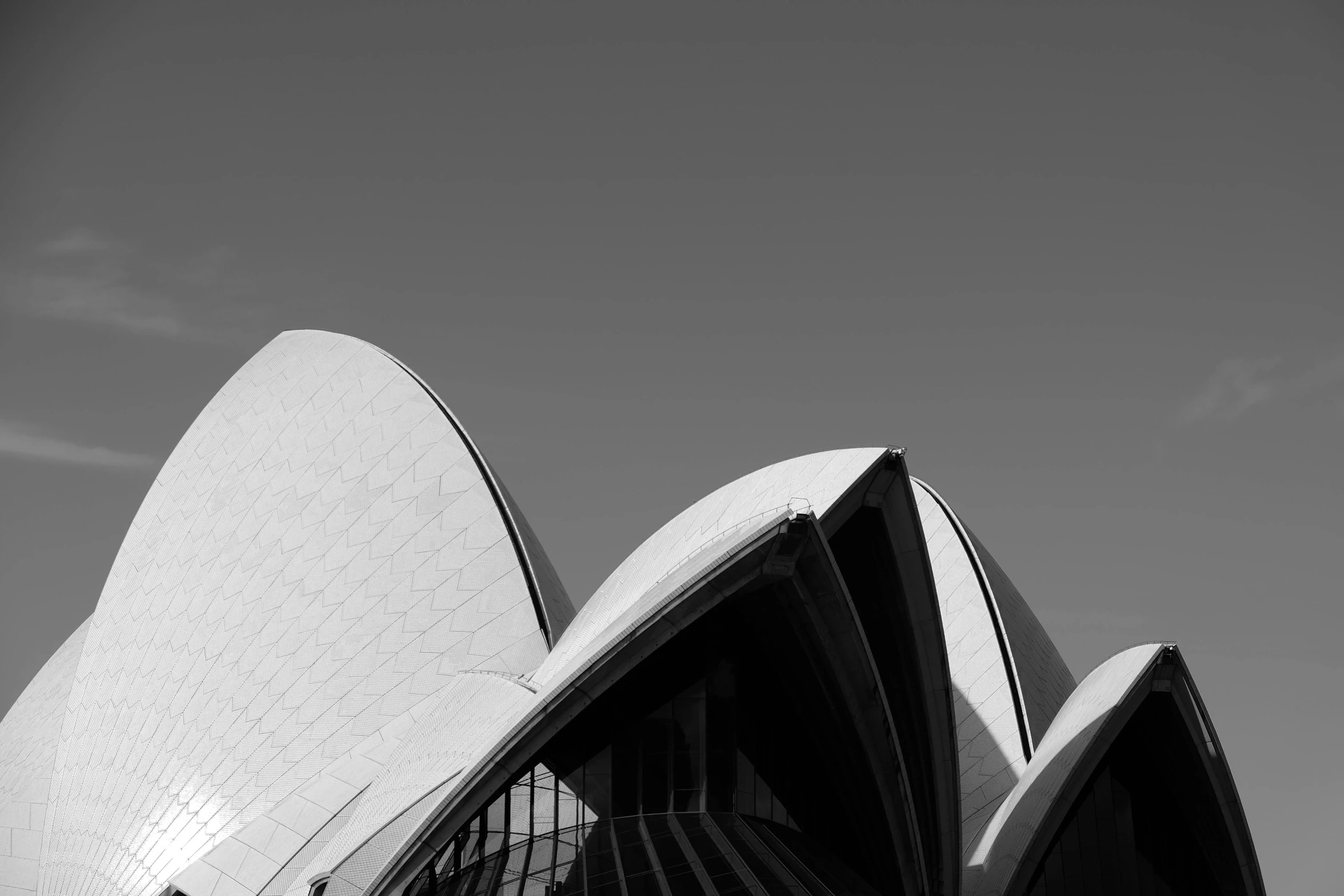 a black and white photo of the sydney opera house, a black and white photo, pexels contest winner, modernism, photographic print, rounded roof, 1 2 9 7, white buildings