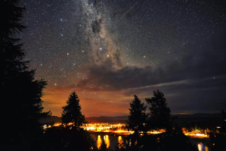 a night sky filled with lots of stars, pexels contest winner, pacific northwest, distant town lights, instagram post, fire from sky