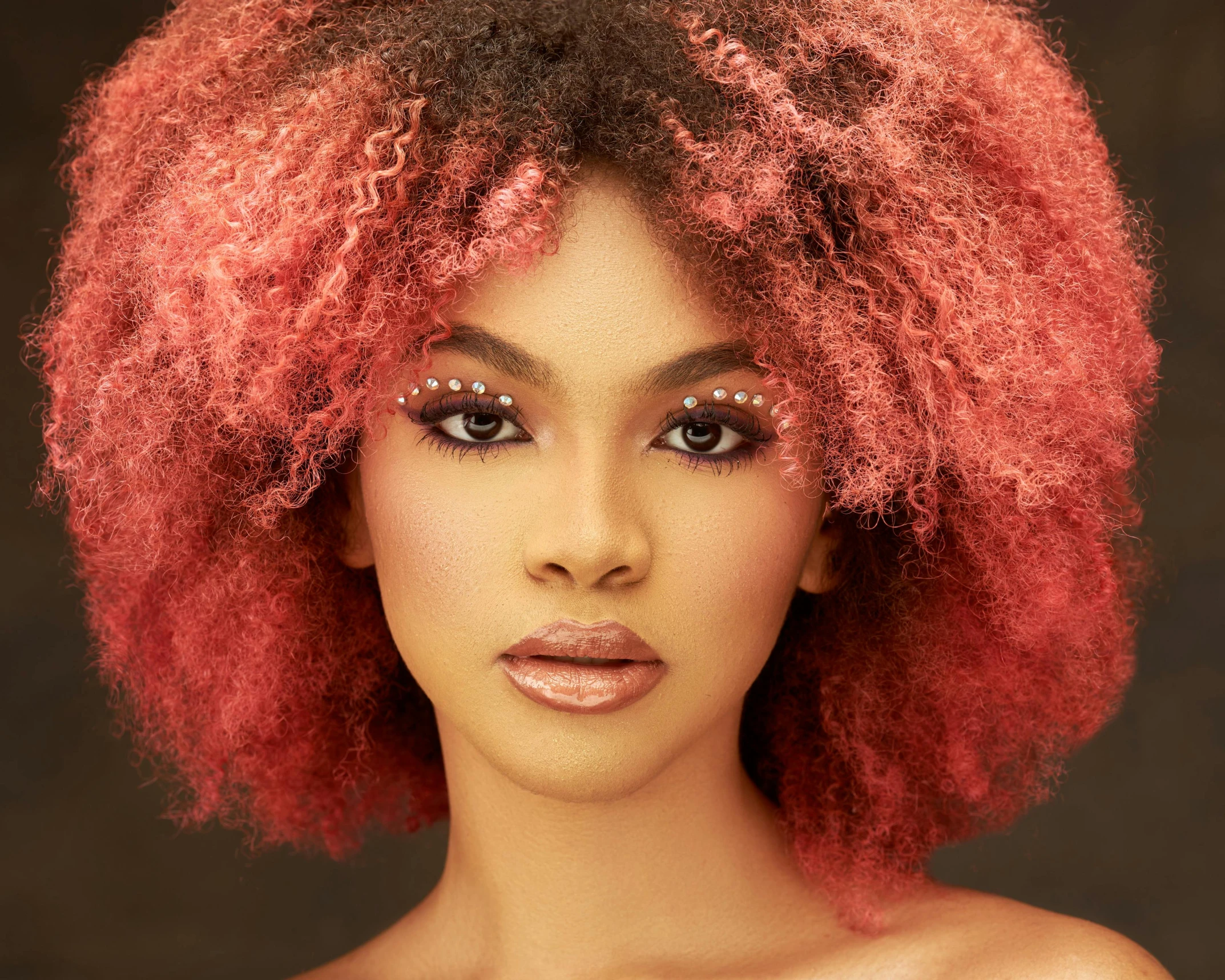 a woman with red hair posing for a picture, an album cover, by Chinwe Chukwuogo-Roy, trending on pexels, hair texture, pink hue, colored, young queen jezebel