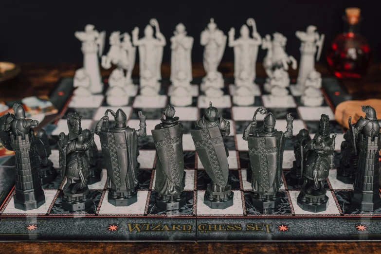 a close up of a chess board on a table, an engraving, by Adam Marczyński, unsplash contest winner, art nouveau, wearing wizard robes, hogwarts gryffindor common room, mini model, opal statues