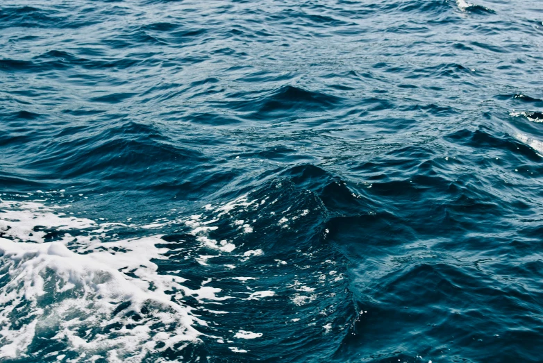 a view of the ocean from a boat, an album cover, unsplash, water texture, currents, cerulean, navy