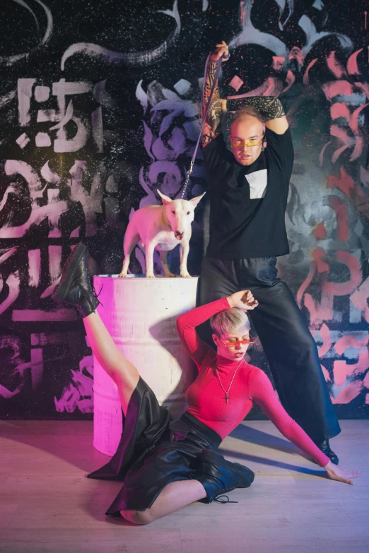 a couple of people that are on a stage, dada, resembling a mix of grimes, with dogs, contemporary dance poses, promo image