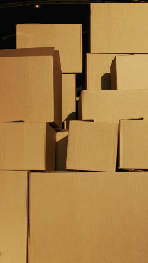 a bunch of boxes stacked on top of each other, pexels, panel, reuters, sienna, made of cardboard