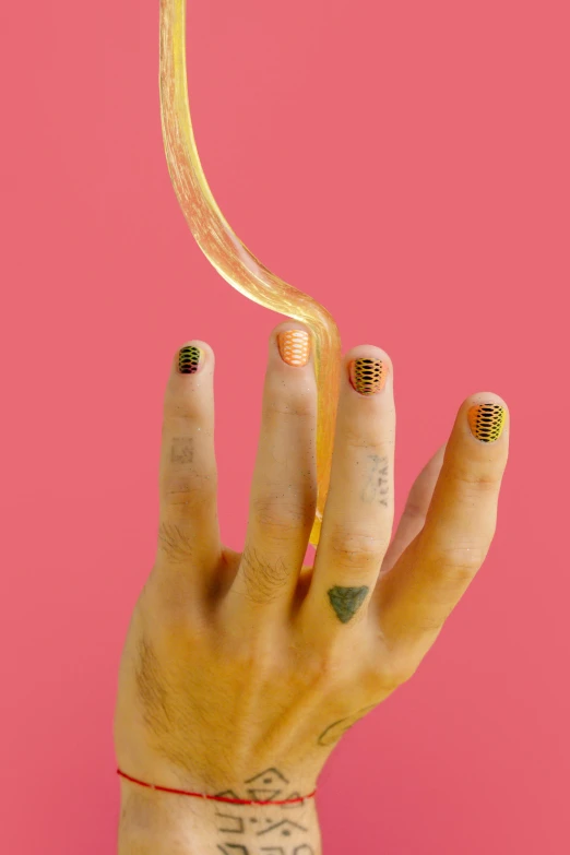 a close up of a person's hand holding a banana, by Olivia Peguero, pop art, gold bodypaint, dot gradient, dynamic linework, pink and orange