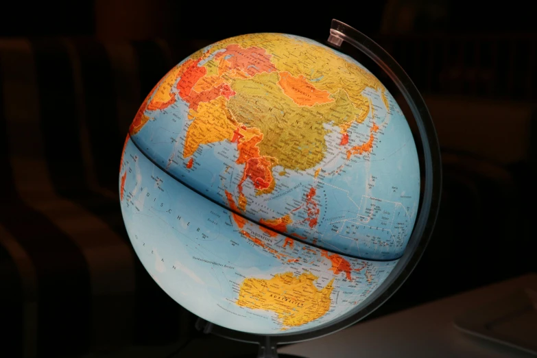 a close up of a globe on a table