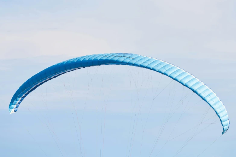 a person parasailing in the sky on a sunny day, by Julian Allen, pexels contest winner, hurufiyya, long blue-cape, hyper-detail, arc, blue print